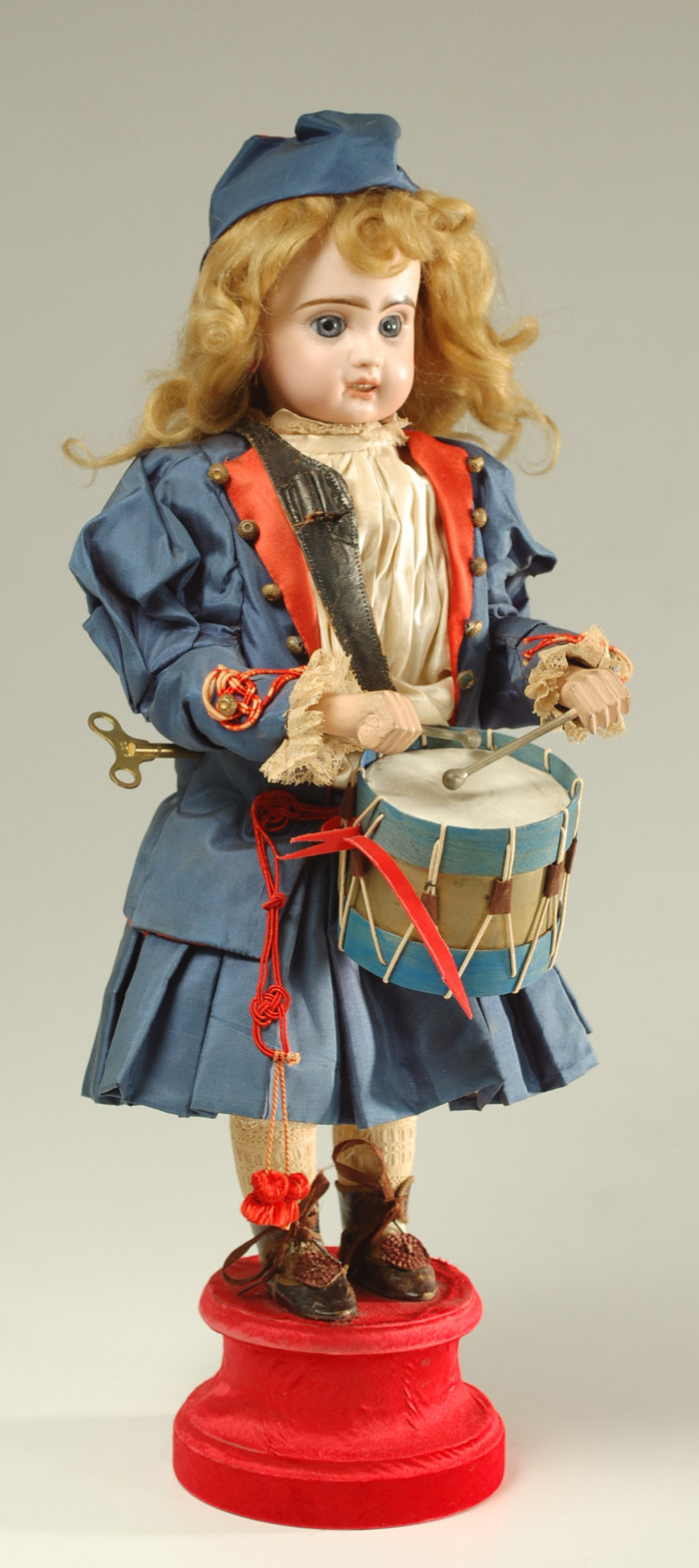 Appraisal: JUMEAU AUTOMATON DRUMMER GIRL DOLL bisque head having blond wig