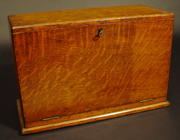 Appraisal: s oak stationery box the hinged lid and fall opening