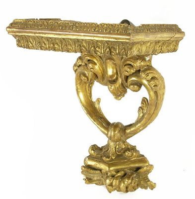 Appraisal: A giltwood and gesso bracket the rectangular leaf edge top