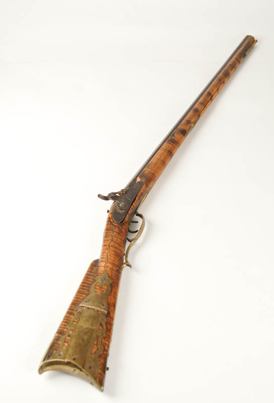 Appraisal: A th C Percussion Long Rifle having an octagonal barrel