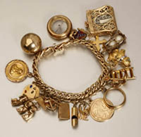 Appraisal: A gold charm bracelet A gold charm bracelet K yellow