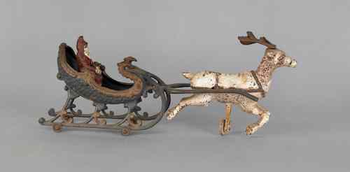 Appraisal: Cast iron Santa and sleigh pull toy late th c