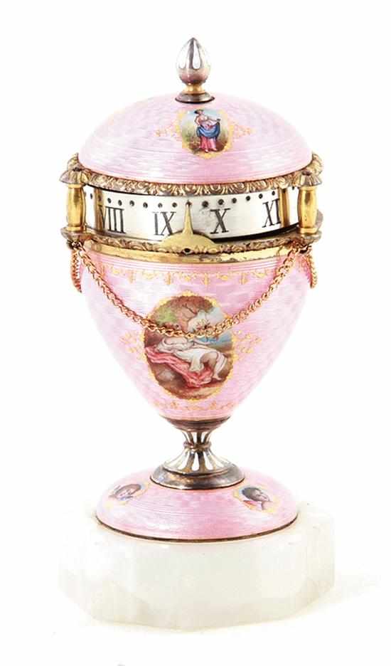 Appraisal: Continental enamel-decorated annular clock egg-form body enameled in translucent pink