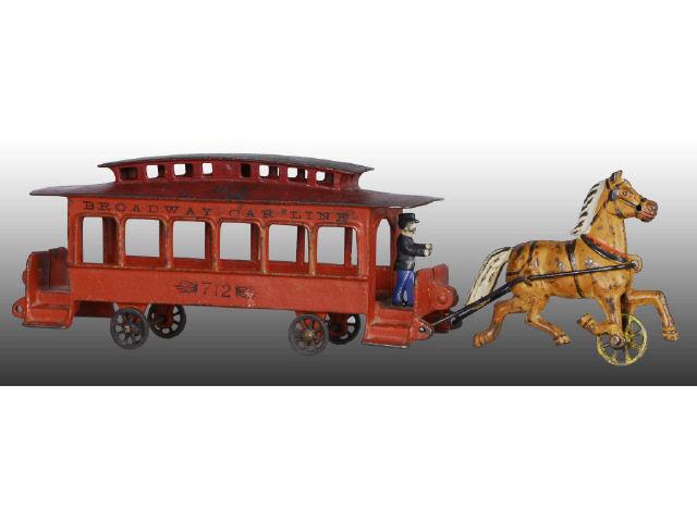 Appraisal: Cast Iron Wilkins Broadway Trolley Toy Description Horse-drawn pulled by