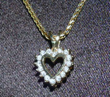 Appraisal: Ladies k gold and diamond pendant with chain heart shaped