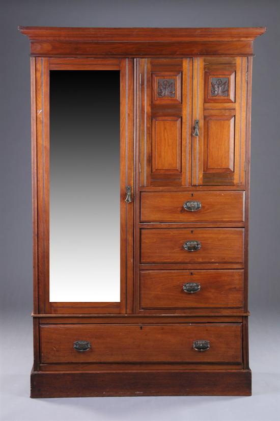 Appraisal: LATE VICTORIAN EASTLAKE WARDROBE early th century walnut in three