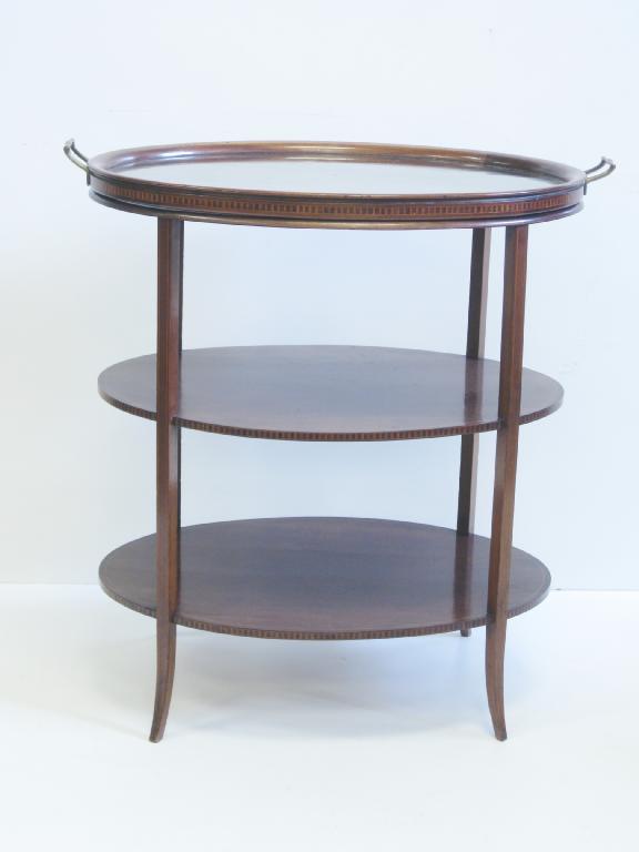 Appraisal: An Edwardian mahogany oval three tier Etargere with tray top