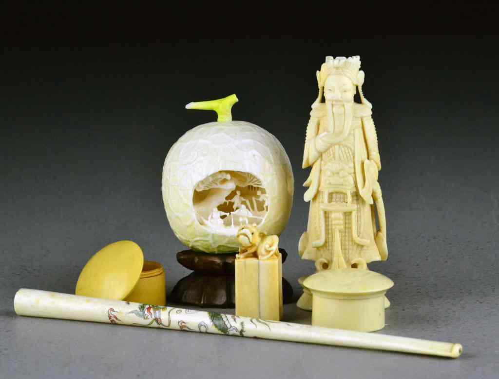 Appraisal: Pieces Chinese Carved IvoryTo include a carved ivory fruit carved