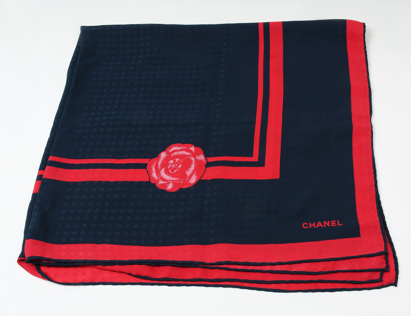 Appraisal: VINTAGE CHANEL NAVY BLUE RED CC EMBOSSED SILK SCARF Beautiful