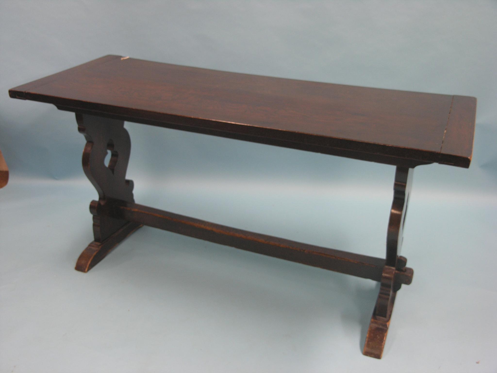 Appraisal: A solid dark oak refectory-type dining table plank-top on shaped