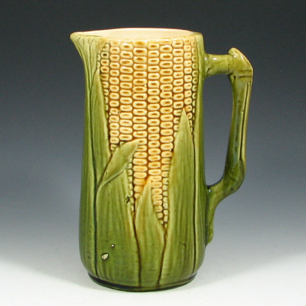 Appraisal: McCoy Corn Pitcher McCoy corn pitcher Marked Few small glaze