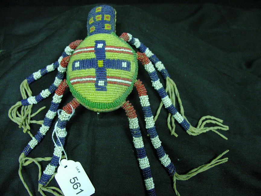 Appraisal: NATIVE AMERICAN BEADED SPIDER AMULET Hand sewn Leather eight legged