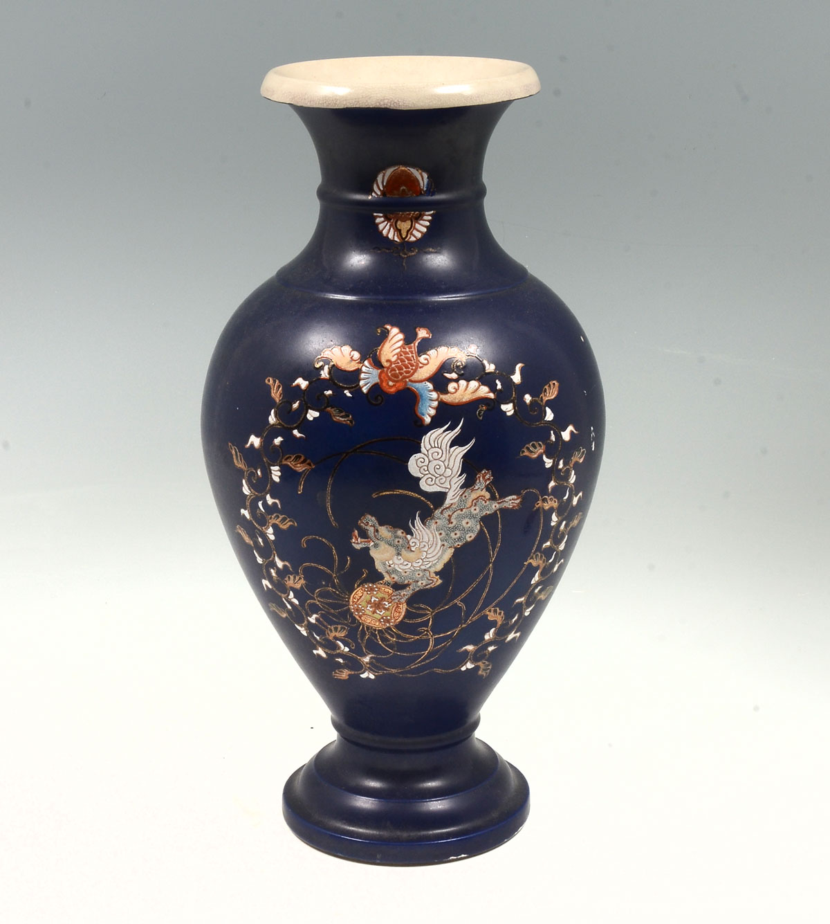 Appraisal: JAPANESE FOO DOG VASE Blue ground Japanese vase having hand-painted