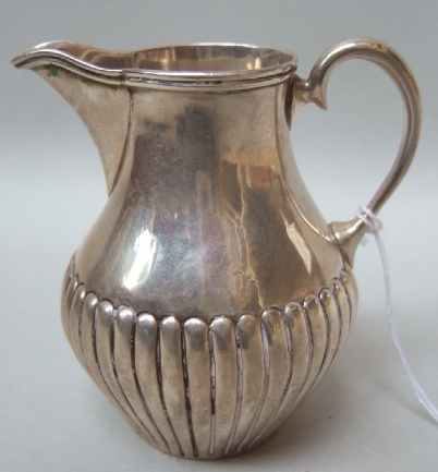 Appraisal: A Victorian silver cream jug of baluster form with half