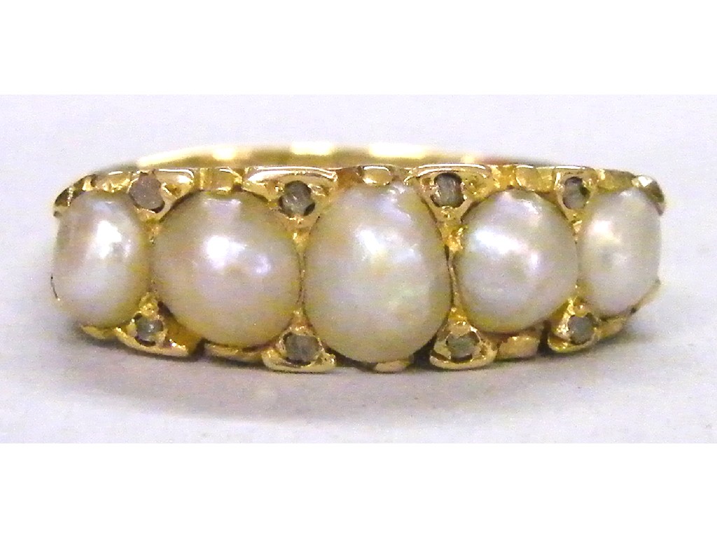 Appraisal: Edwardian ct five stone natural pearl ring in a scroll