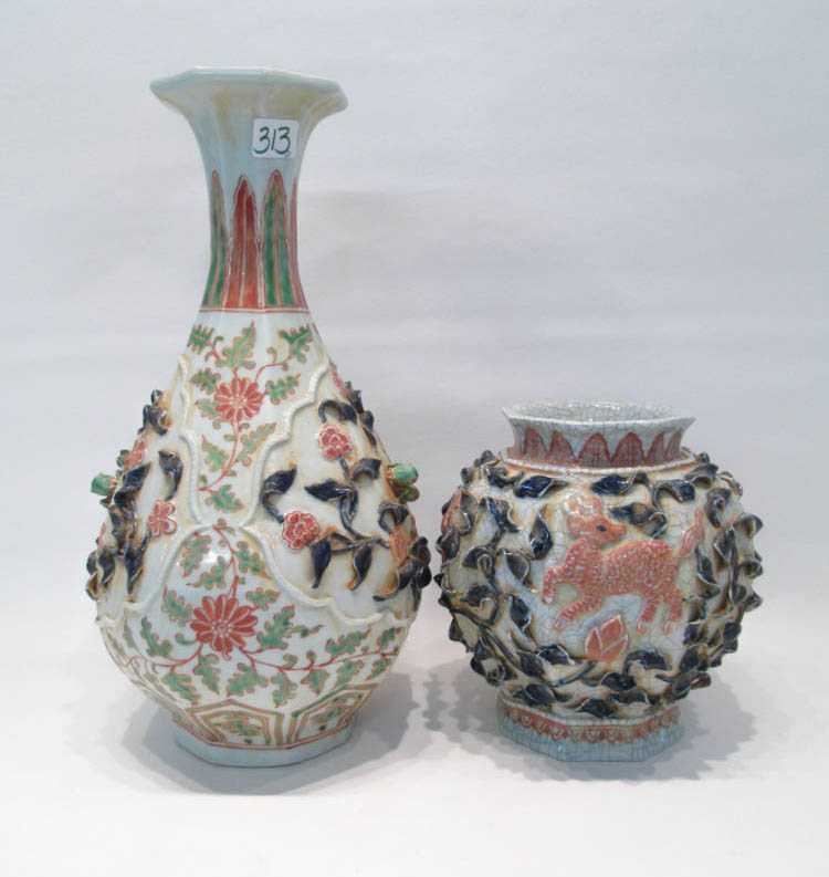 Appraisal: TWO PERSIAN INSPIRED POTTERY VASES having applied high-relief leaf and