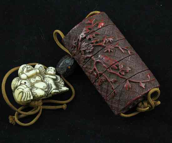 Appraisal: A Meiji period four-case carved tsuishu lacquer inro decorated with