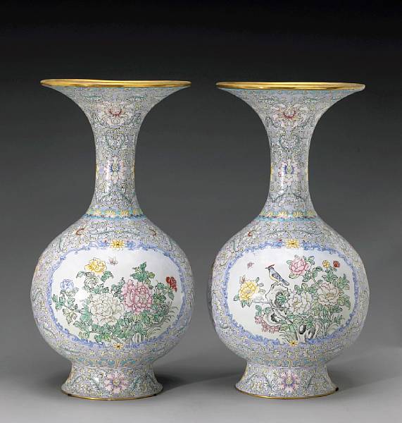 Appraisal: A pair of lavender ground enameled metal vases Each displaying