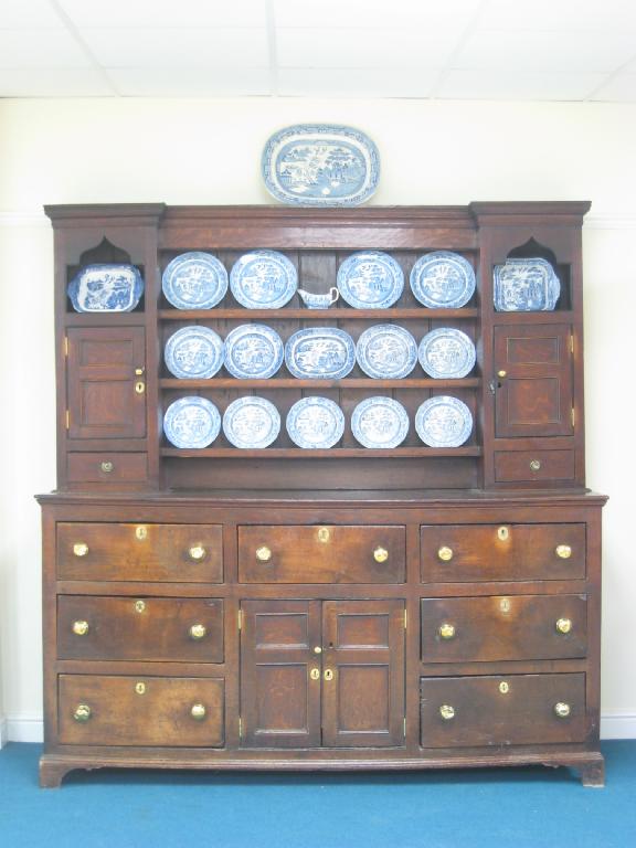 Appraisal: An antique oak Dresser the rack with shelves flanked by