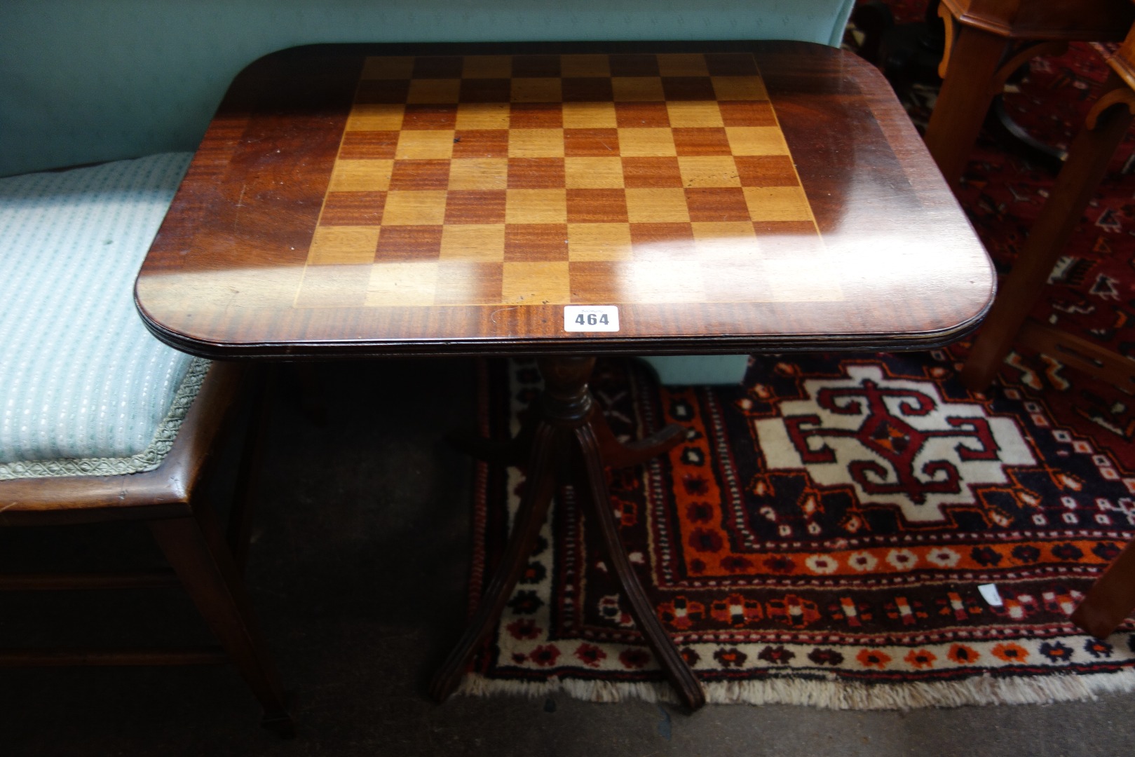 Appraisal: A reproduction Regency style mahogany and satinwood games table with