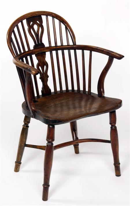 Appraisal: A late th century yew wood and elm Windsor Chair