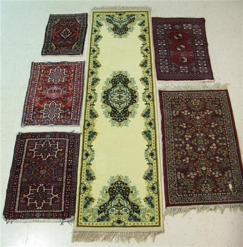 Appraisal: FIVE SMALL RED-TONE THROW RUGS AND BEIGE RUNNER