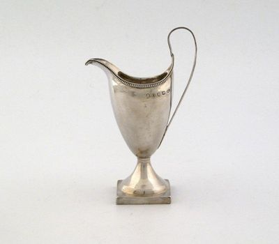 Appraisal: A George III plain helmet cream jug with beaded rim