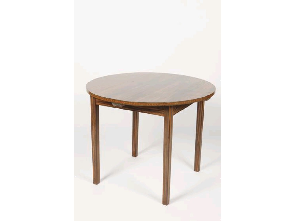 Appraisal: ERNEST W GIMSON A CIRCULAR TOPPED MACCASSAR EBONY TABLE the