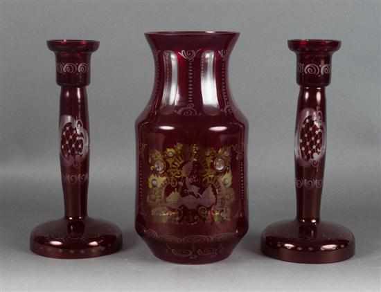 Appraisal: Pair of Bohemian style cranberry etched-to-clear glass candlesticks and similar