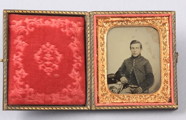 Appraisal: Sixth plate ambrotype of Civil War soldier wearing nine-button tunic