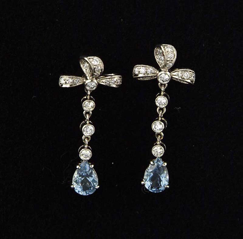 Appraisal: PAIR OF GOLD AQUAMARINE AND DIAMOND EARRINGS Pierce mounted earrings