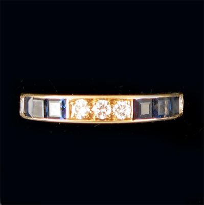 Appraisal: A sapphire and diamond half eternity ring with circular cut