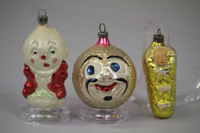 Appraisal: THREE BLOWN GLASS ORNAMENTS Germany includes clown boy on ball