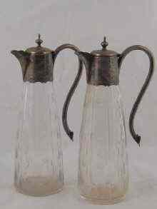 Appraisal: A pair of silver plate mounted claret jugs circa approx