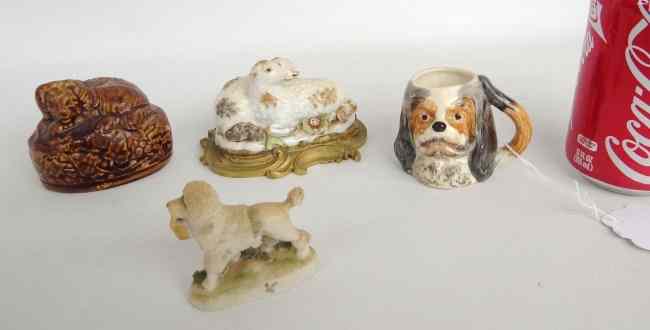 Appraisal: Lot including Rockingham glazed dog Staffordshire dog Staffordshire sheep grouping