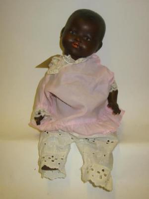 Appraisal: An Armand Marseille bisque head black doll with brown sleeping