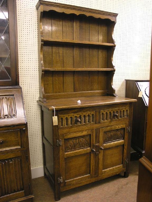 Appraisal: A dark oak Welsh dresser with two shelf plate rack