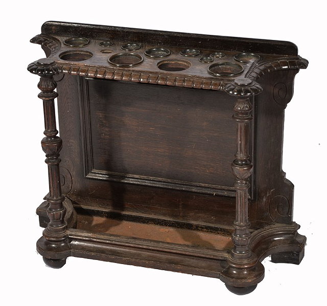 Appraisal: A VICTORIAN CARVED OAK HALL STAND with two turned and