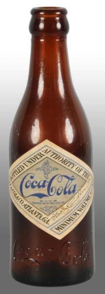 Appraisal: Glass Coca-Cola Amber Bottle Description Made in New York New