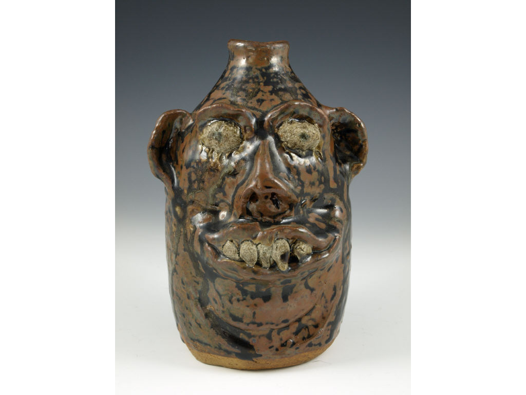 Appraisal: Georgia Folk Pottery Marie Rogers Face Jug molded with roughly