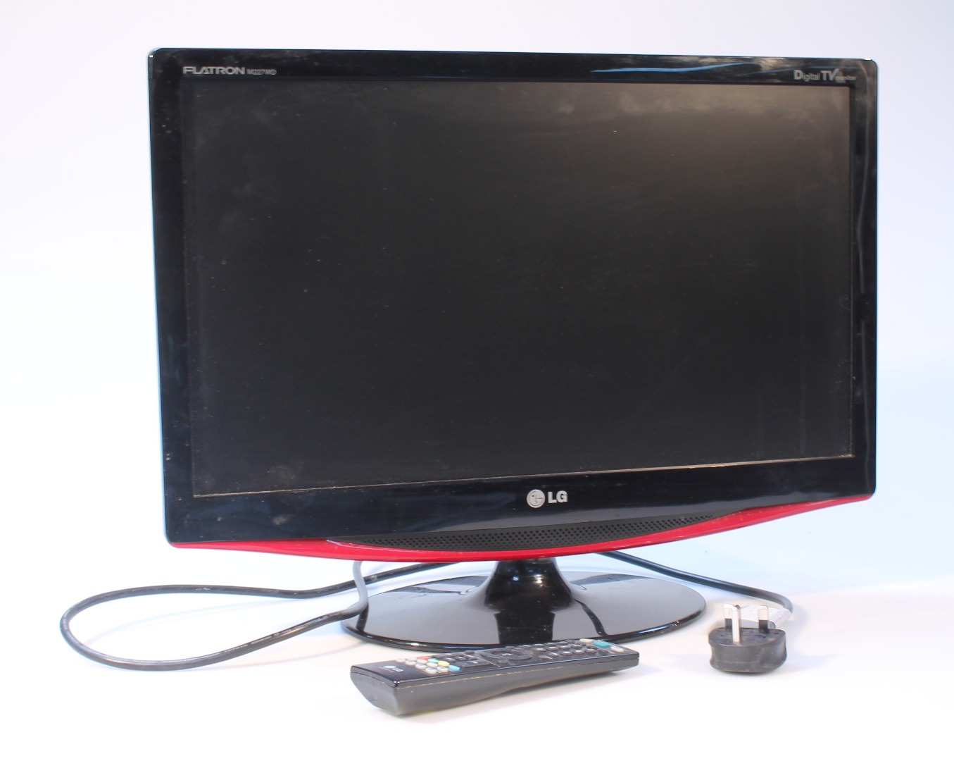 Appraisal: An LG Flatron digital television monitor in black with remote