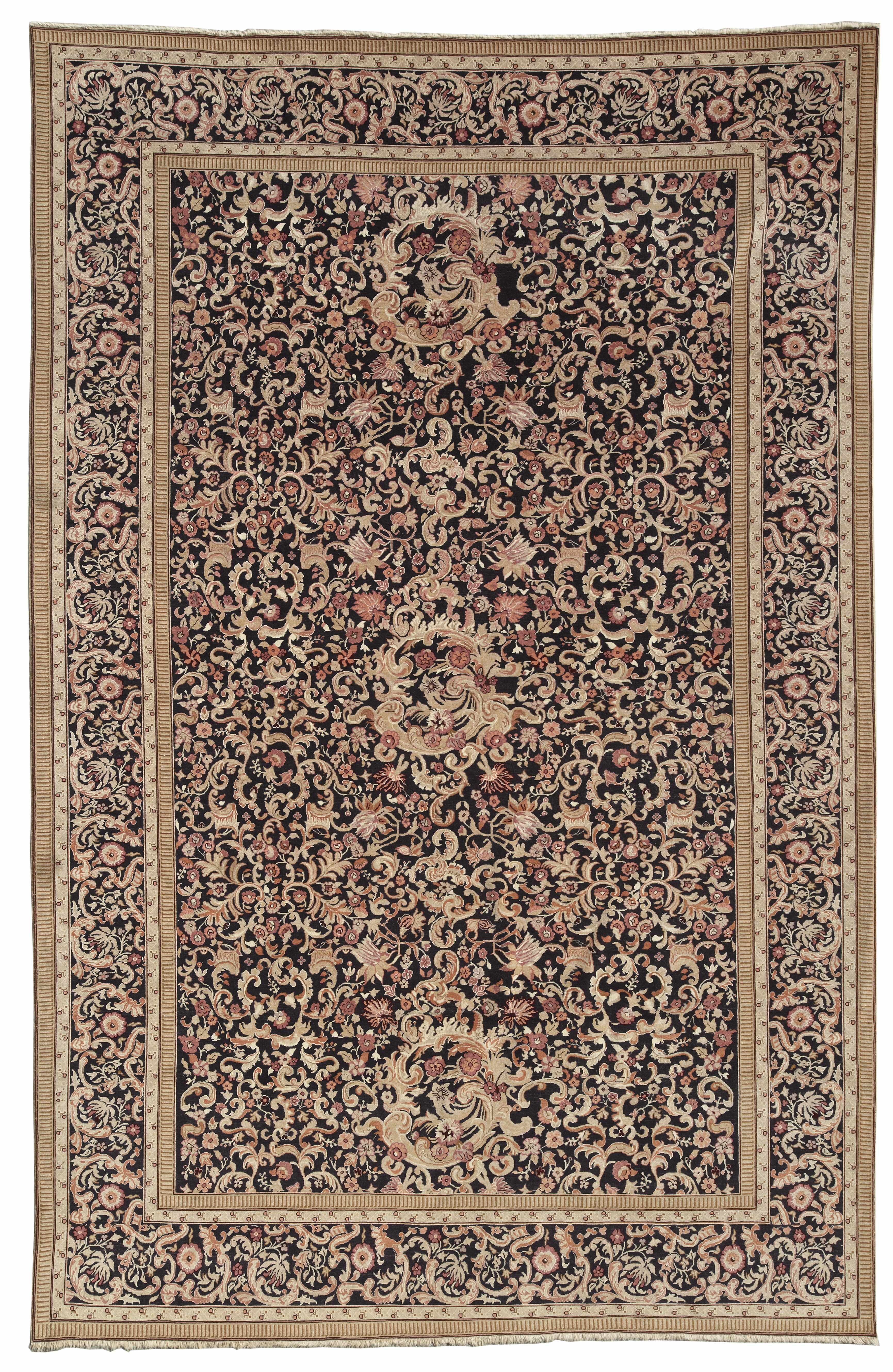 Appraisal: A machine made Persian style carpet approximately in cm x