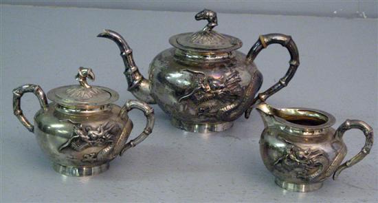 Appraisal: th century Chinese white metal three piece tea service comprising