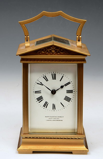 Appraisal: A FRENCH CARRIAGE TIMEPIECE with white enamel Roman dial inscribed