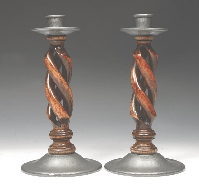 Appraisal: A PAIR OF TUDRIC PEWTER AND OAK BARLEY-TWIST CANDLESTICKS attributed