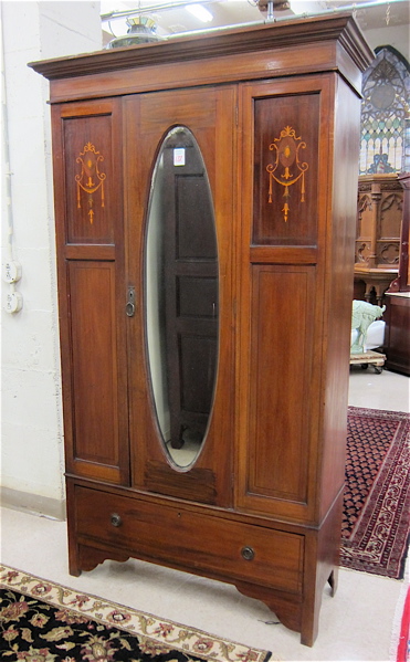 Appraisal: AN EDWARDIAN INLAID MAHOGANY WARDROBE English c - the front