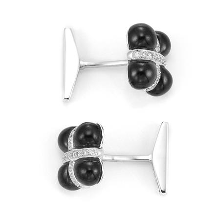 Appraisal: Pair of White Gold Black Onyx and Diamond Cufflinks Estimate