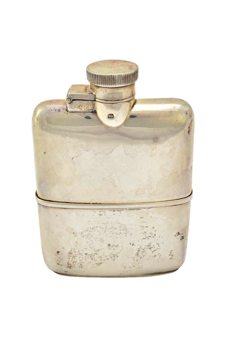 Appraisal: A silver spirit flask of plain rectangular form having a