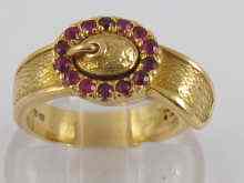 Appraisal: A hallmarked carat gold and ruby buckle ring maker BR