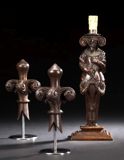 Appraisal: Pair of French Carved and Stained Oak Fleur-de-Lis Finials in